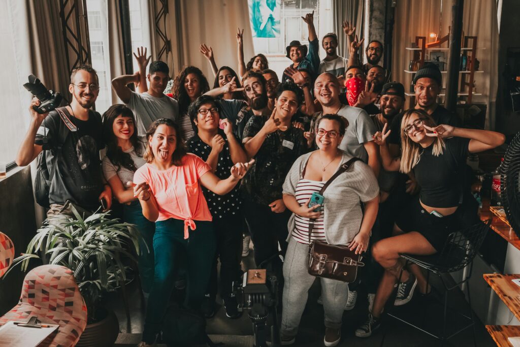 Diverse group enjoying a cheerful meeting indoors in São Paulo, capturing unity and joy.